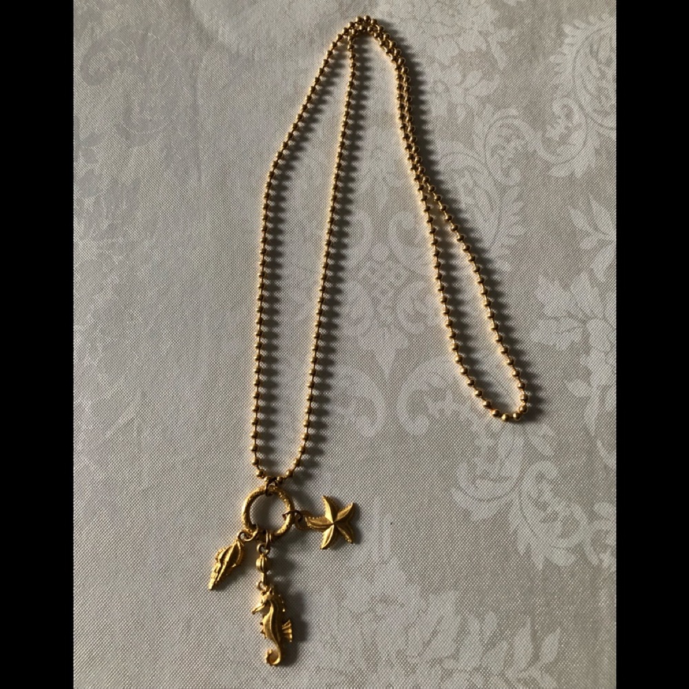 Gold tone summer motif necklace